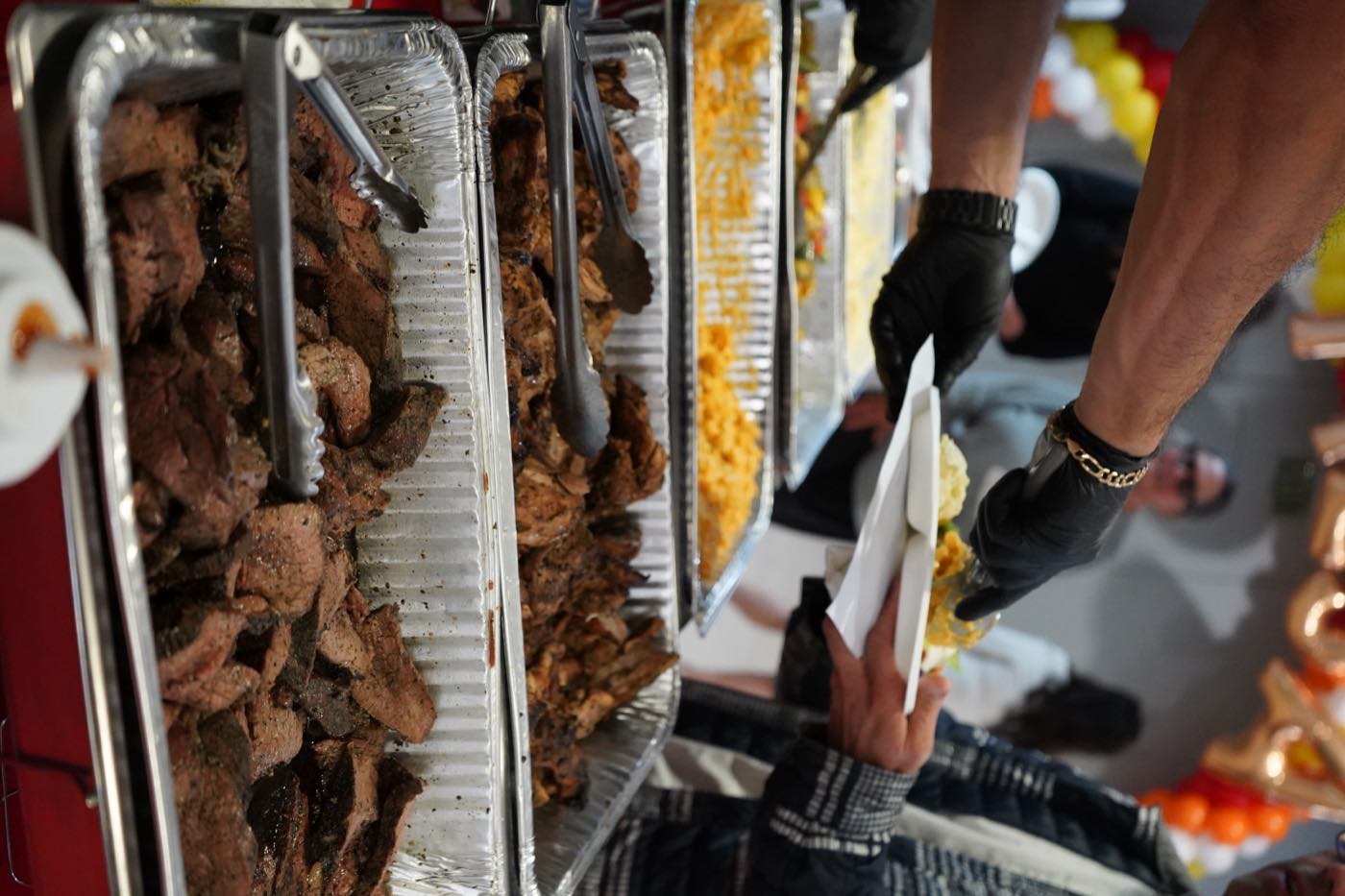 Roosters taco bar line at an event