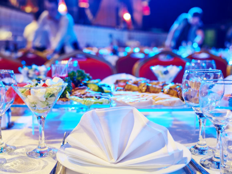 An image showing a catering team setting up a buffet table.