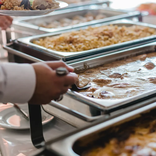 An image showing someone serving delicious food for a Sacramento Mexican food catering company.