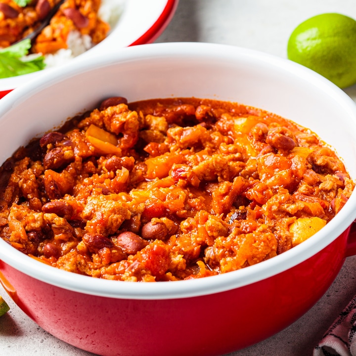 Vegan chili con carne with vegetables and beans in tomato sauce